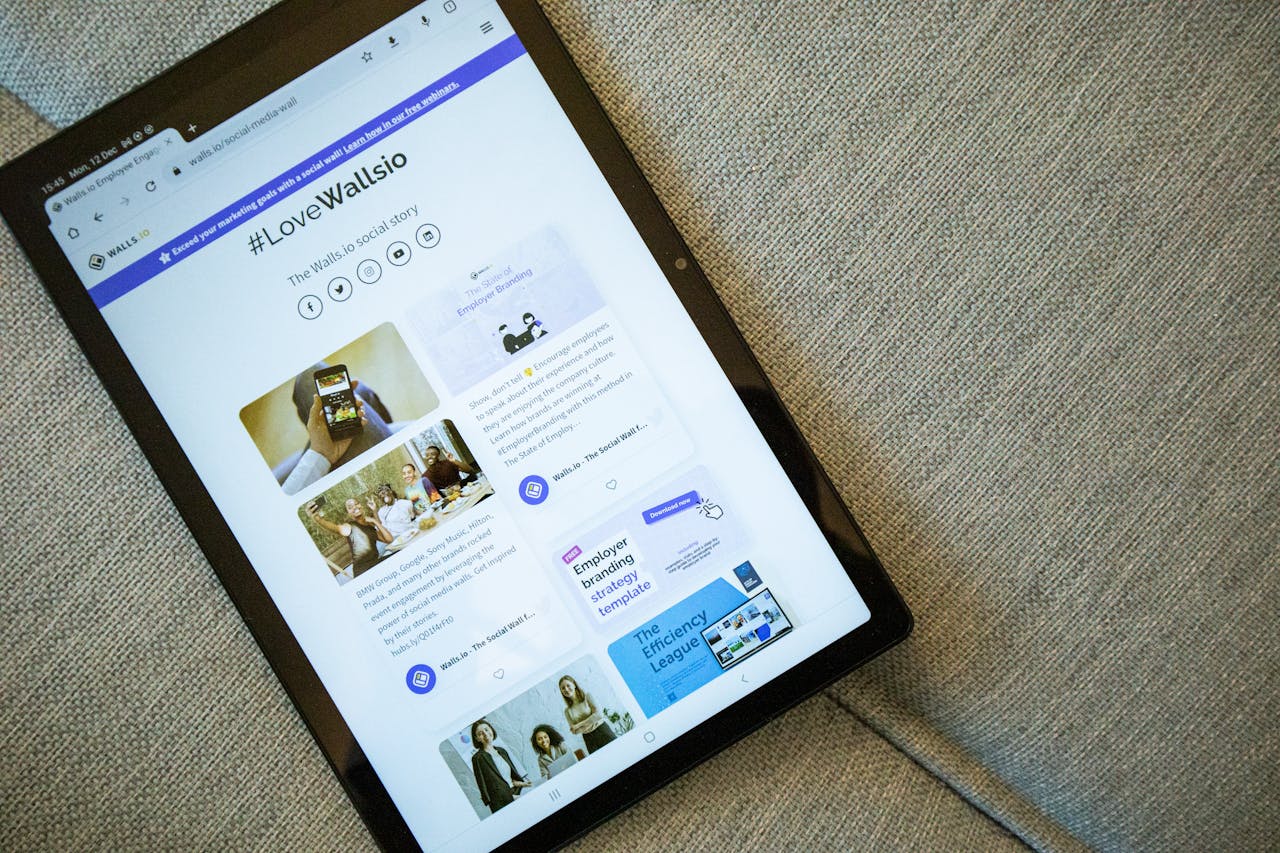 about-01 A tablet on a couch showing the Wallis.io website interface.